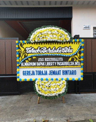 Papan Bunga Duka di Guna